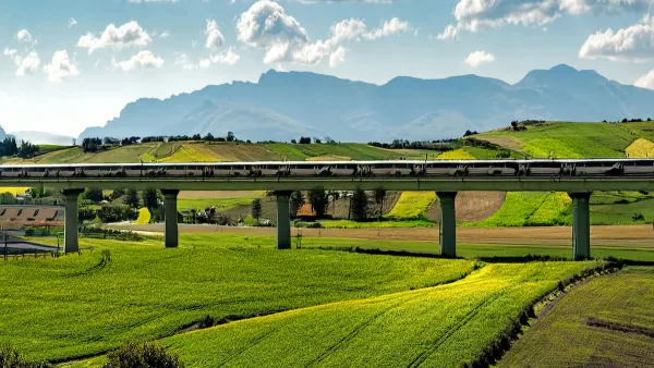 AI-generated image of high-speed rail trail in elevated track in green hilly farmland.